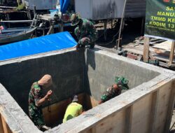 Pembongkaran Papan Mal Tandai Kemajuan Pembangunan Manunggal Air Bersih TMMD Ke-129 di Desa Umbele