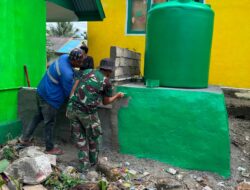 Satgas TMMD Ke-129 Lanjutkan Pengecatan Tandon Air di SDN Umbele Desa Pulau Dua